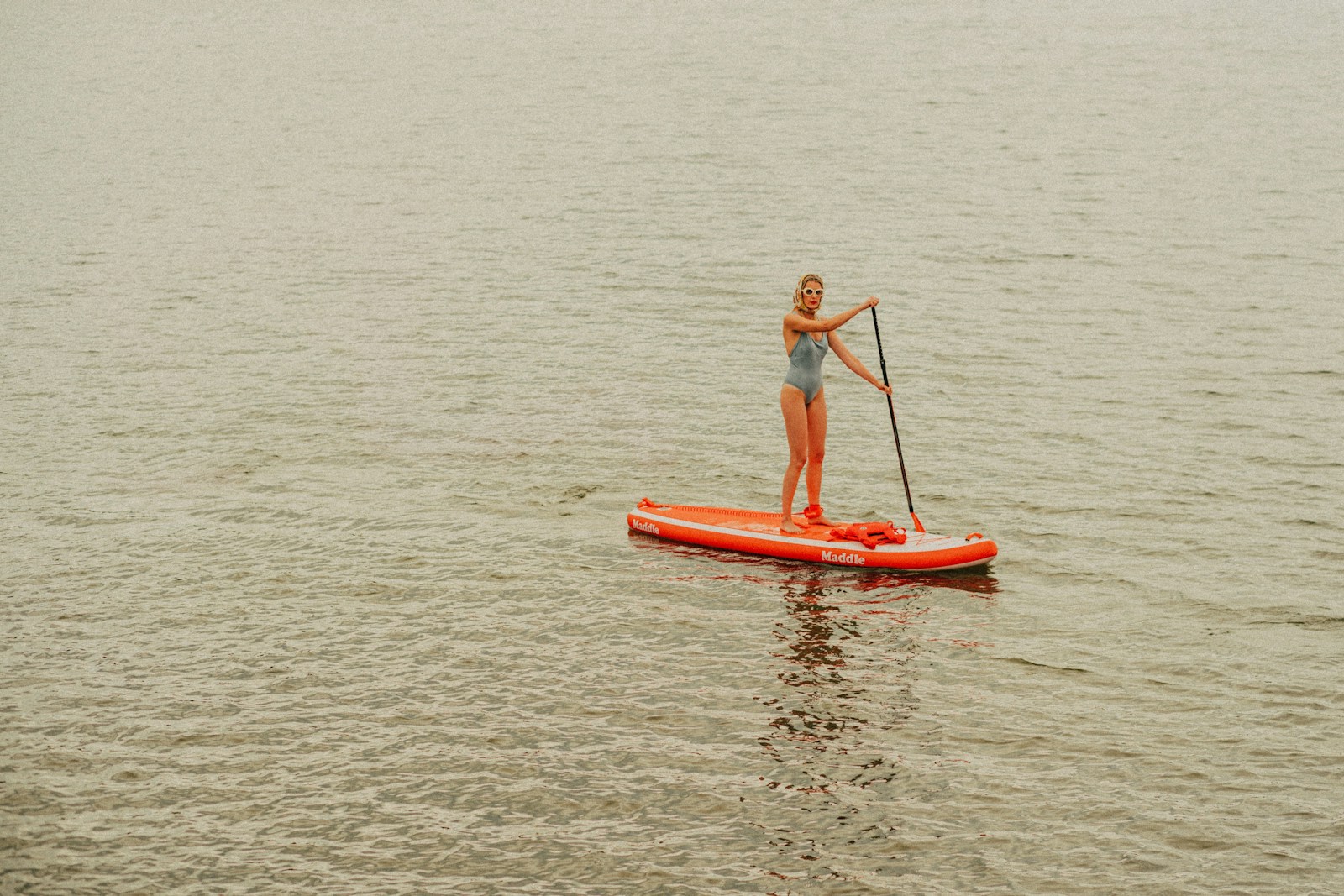 a man paddle boarding